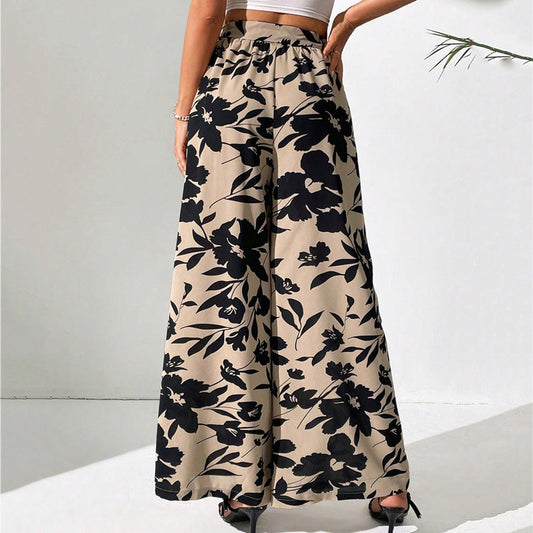 Pantalones de talle alto y pierna ancha con estampado floral de Isabella Sol.