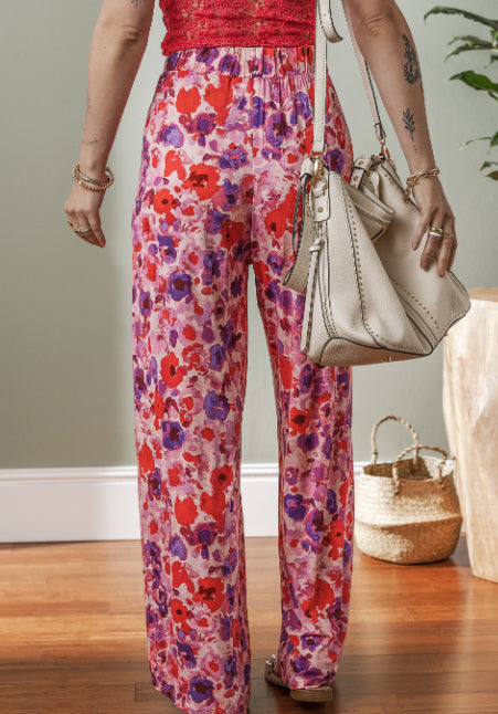 Pantalones de talle alto con estampado floral vibrante de Isabella Sol.