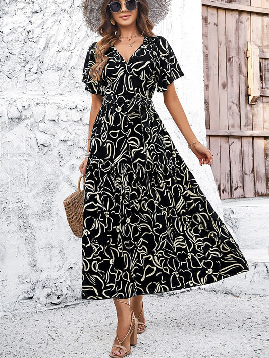 Elegante vestido midi geométrico de manga corta de Isabella Sol