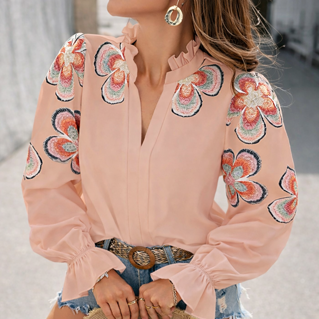 Blusa elegante con escote en V y volantes de Isabella Sol.