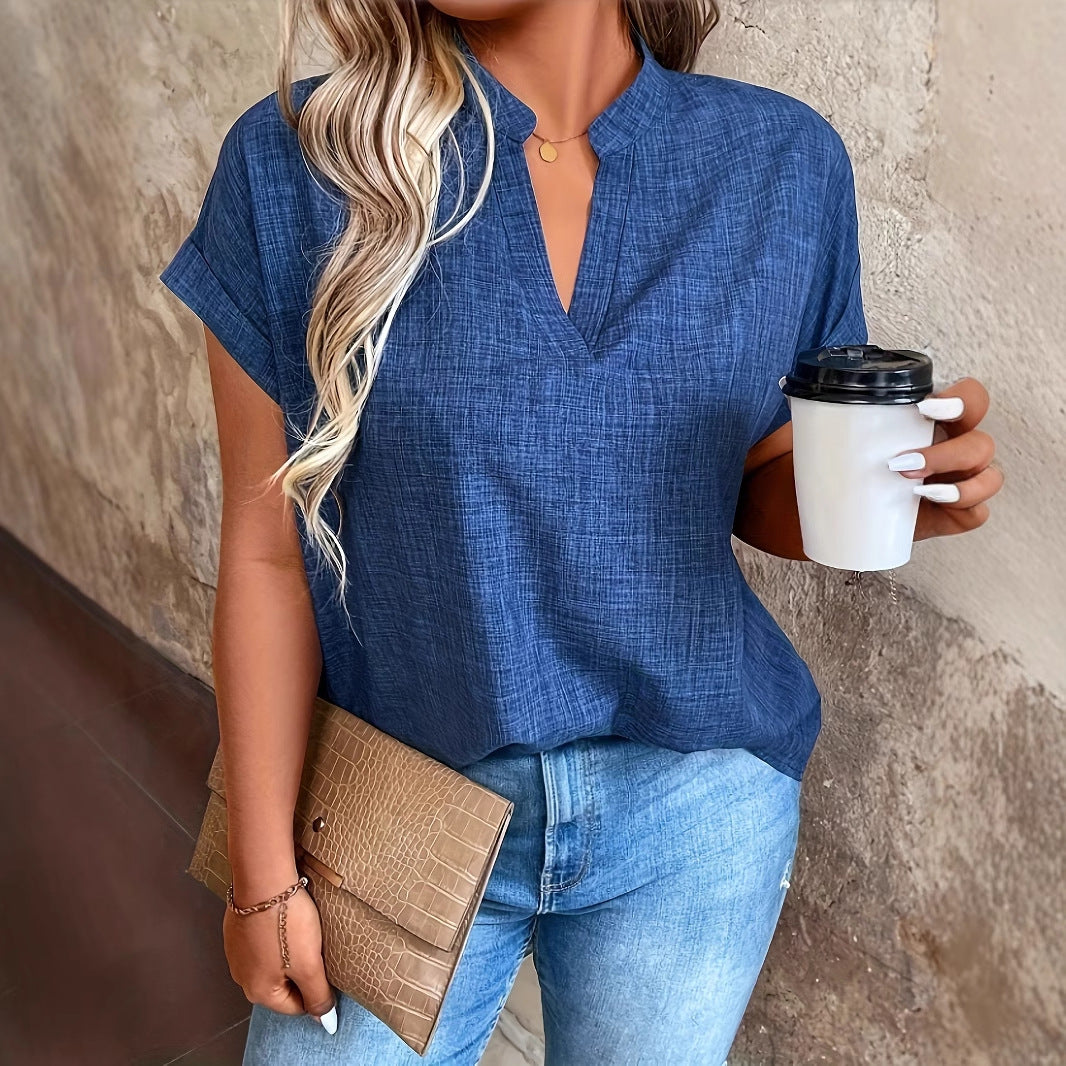 Elegante blusa Isabella Sol con escote en V y mangas murciélago.