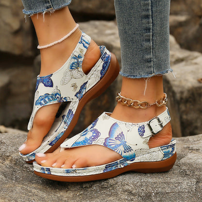 Sandalias de cuña con estampado floral de Isabella Sol.