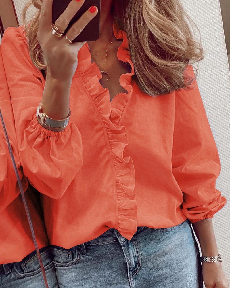 Blusa elegante de manga larga con volantes de Isabella Sol
