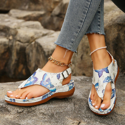 Sandalias de cuña con estampado floral de Isabella Sol.