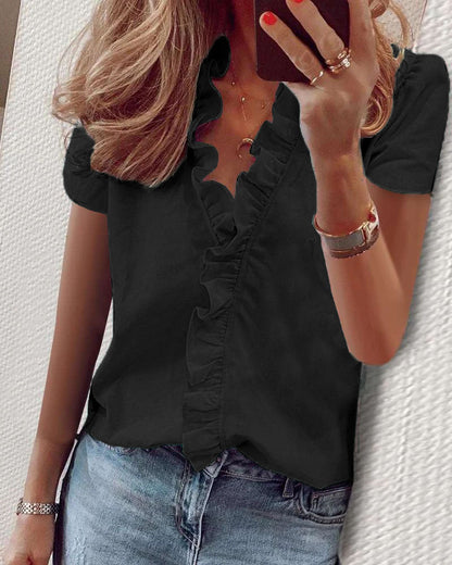 Blusa elegante de manga larga con volantes de Isabella Sol