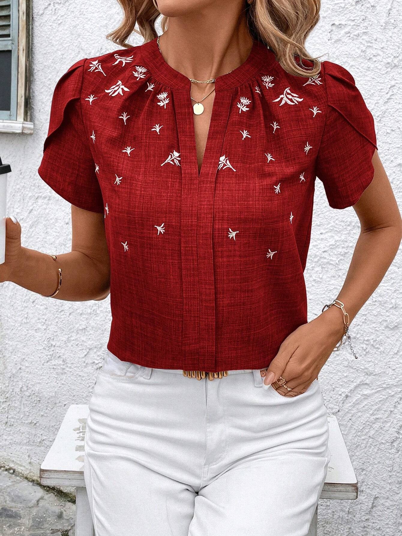 Blusa elegante estampada Isabella Sol con pliegues en los hombros.