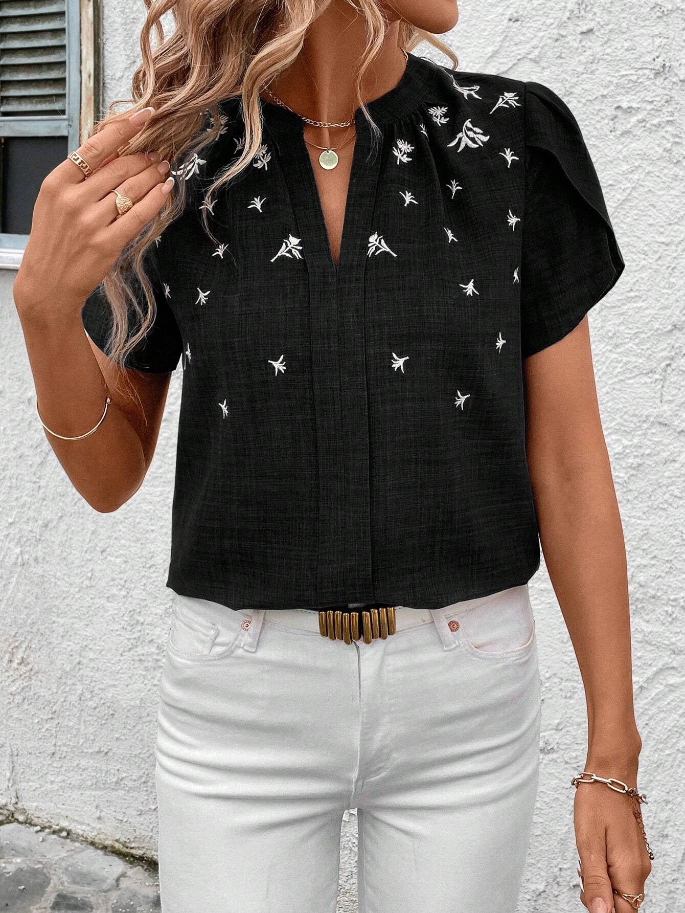 Blusa elegante estampada Isabella Sol con pliegues en los hombros.