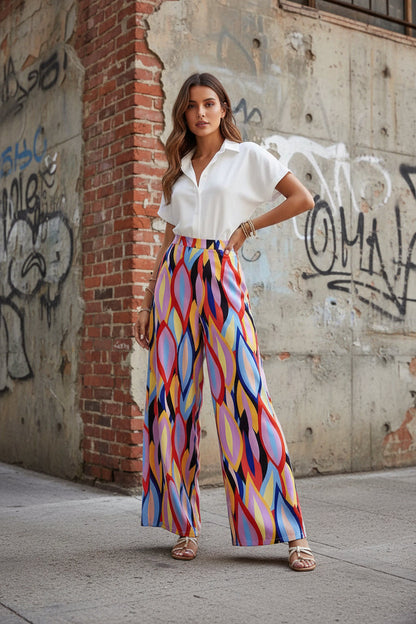 Pantalones acampanados Isabella Sol con estampado vibrante