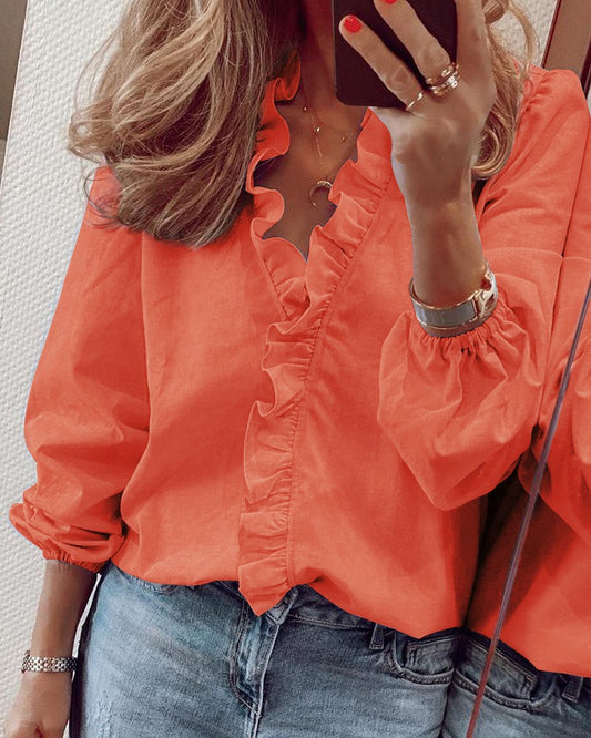 Blusa elegante de manga larga con volantes de Isabella Sol