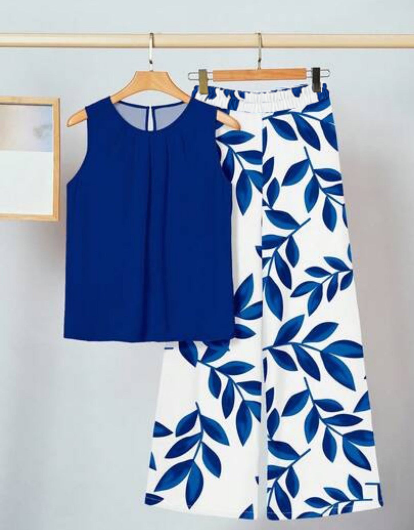 Conjunto de dos piezas para mujer: top sin mangas irregular y pantalón estampado a la moda.