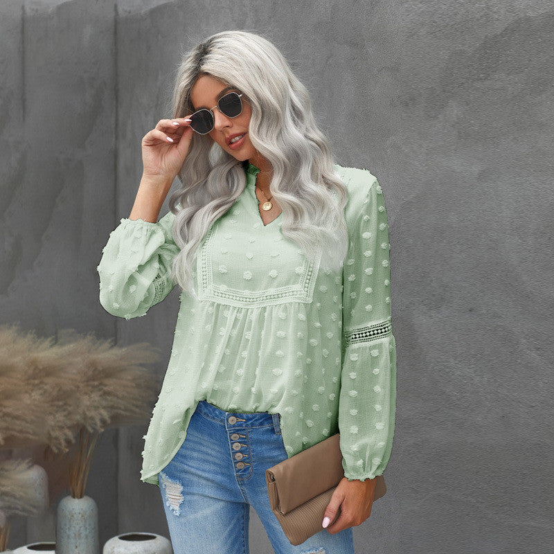 Blusa elegante de encaje con escote en V de Isabella Sol