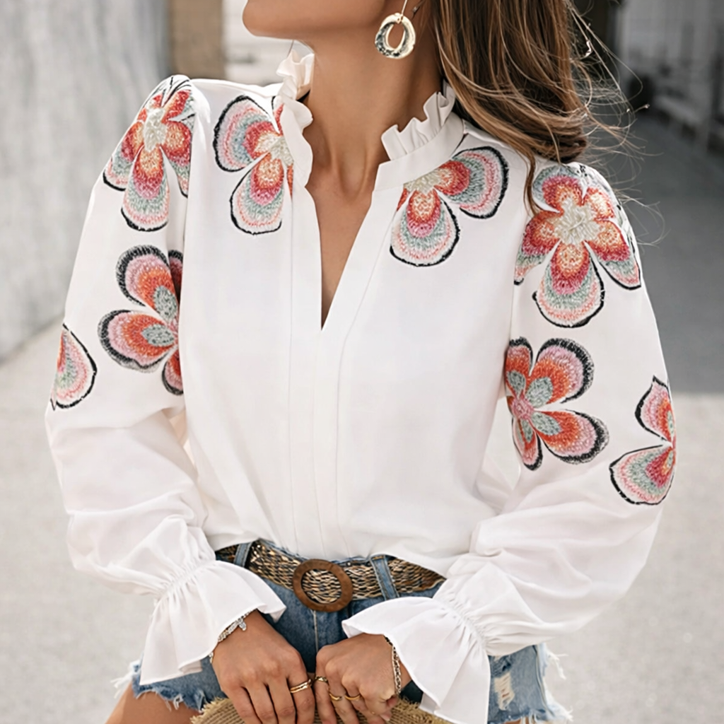 Blusa elegante con escote en V y volantes de Isabella Sol.