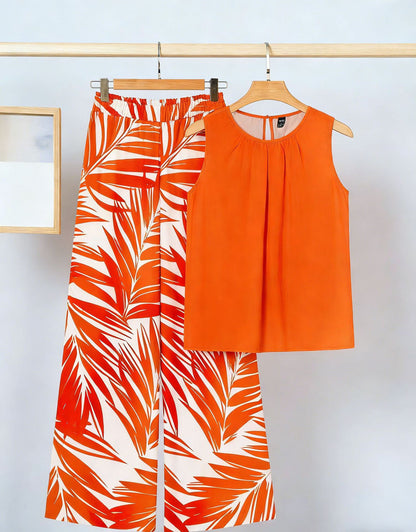 Conjunto de dos piezas para mujer: top sin mangas irregular y pantalón estampado a la moda.