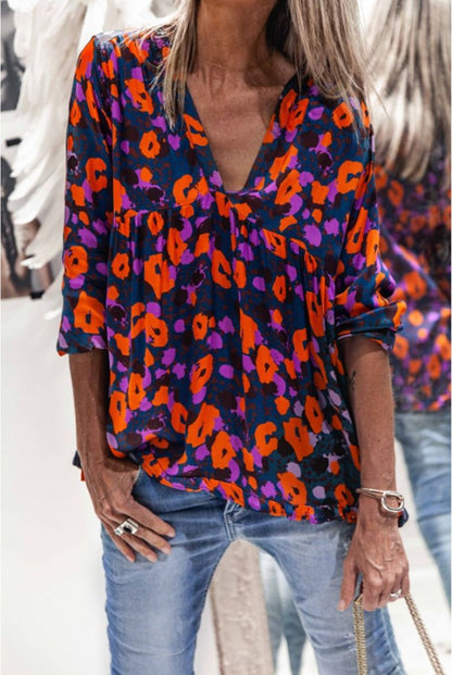 Blusa de manga larga Isabella Sol con estampado floral vibrante
