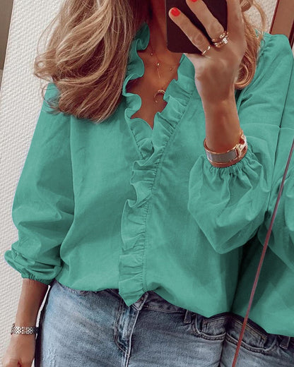 Blusa elegante de manga larga con volantes de Isabella Sol