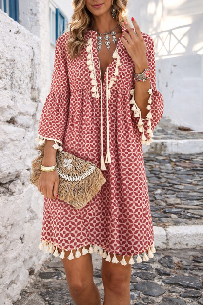 Vestido bohemio con escote en V y borlas de Isabella Sol