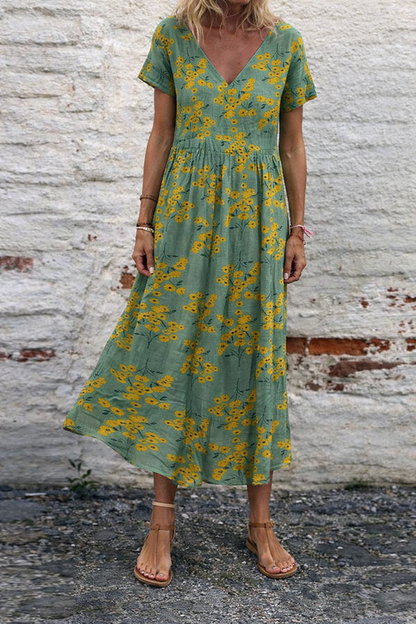 Vestido largo de algodón con escote en V y estampado floral de Isabella Sol.