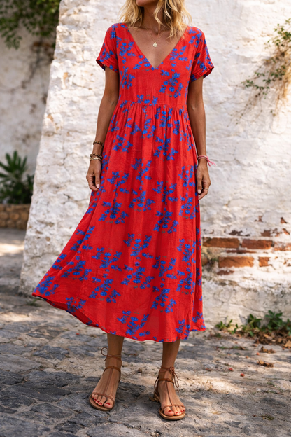 Vestido largo de algodón con escote en V y estampado floral de Isabella Sol.