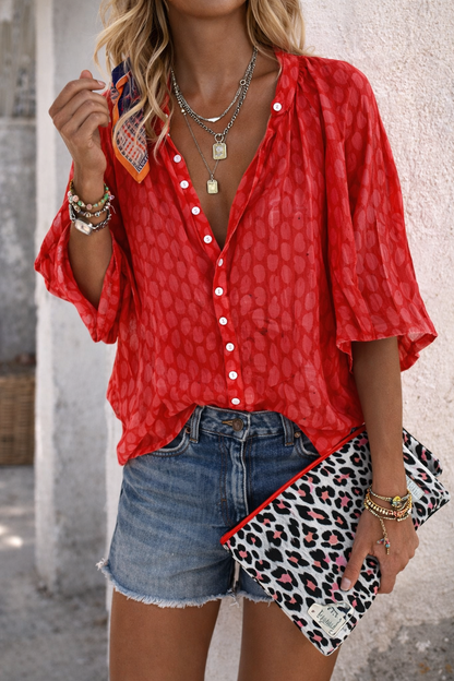 Camisa elegante con estampado y mangas abullonadas de Isabella Sol.