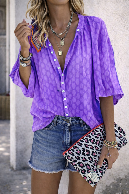 Camisa elegante con estampado y mangas abullonadas de Isabella Sol.