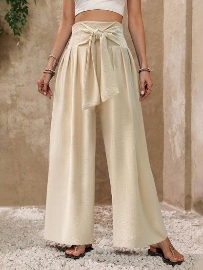 Pantalones casuales de mujer de talle alto, color liso, con lazo frontal y pernera ancha.