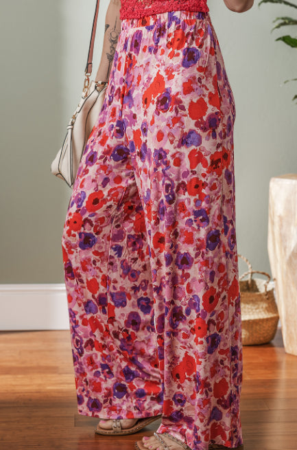 Pantalones de talle alto con estampado floral vibrante de Isabella Sol.