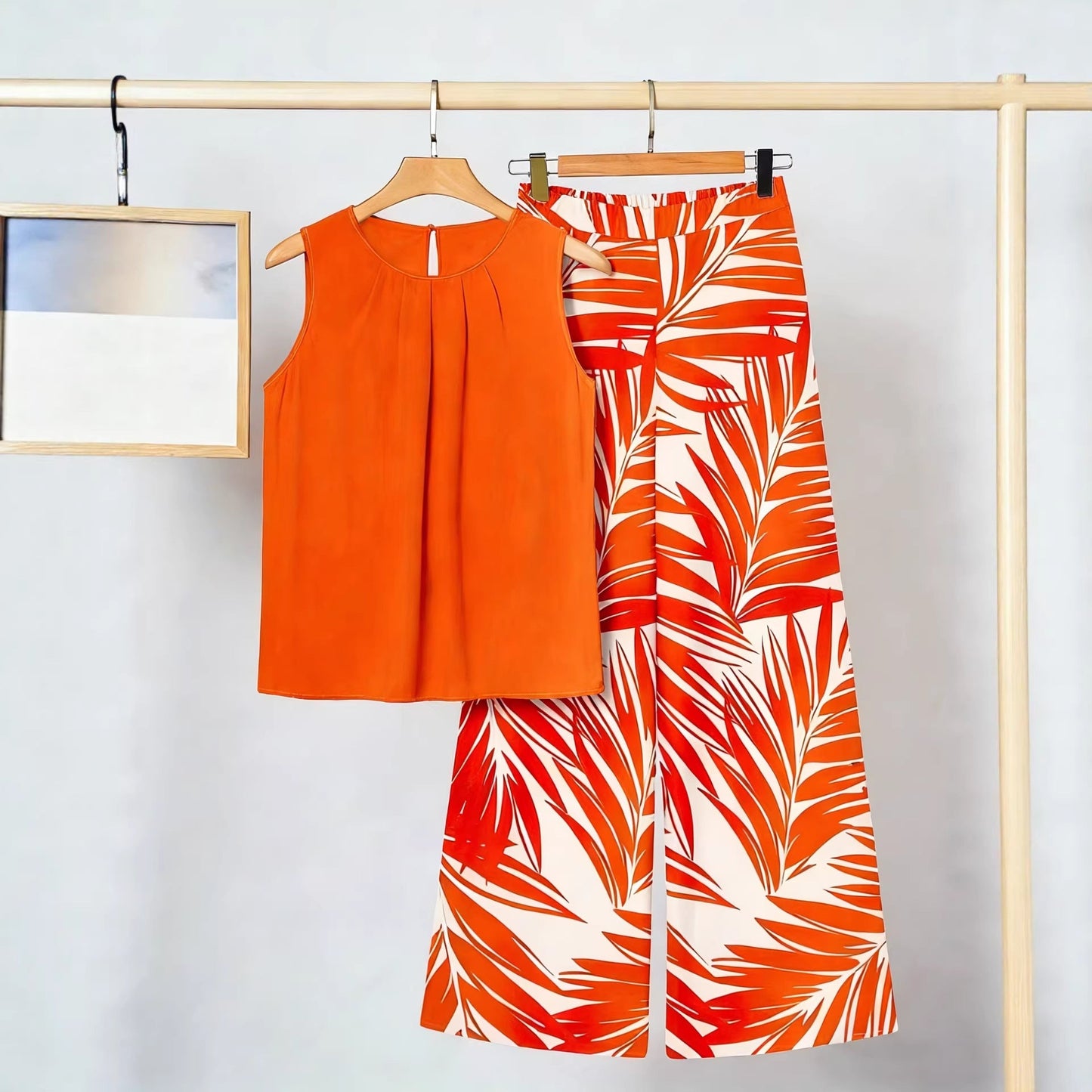 Conjunto de dos piezas para mujer: top sin mangas irregular y pantalón estampado a la moda.
