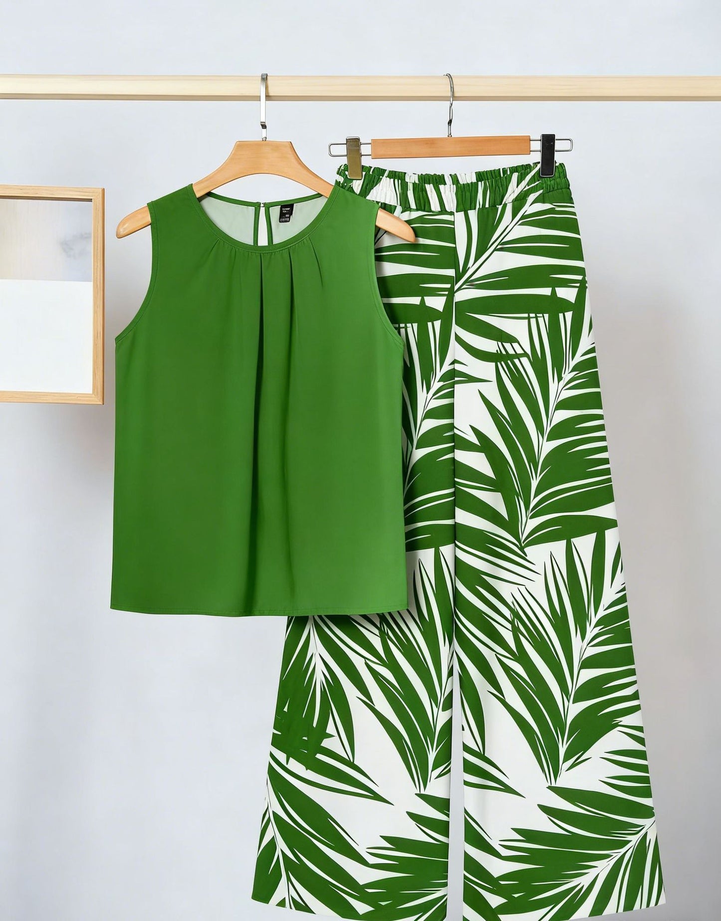 Conjunto de dos piezas para mujer: top sin mangas irregular y pantalón estampado a la moda.