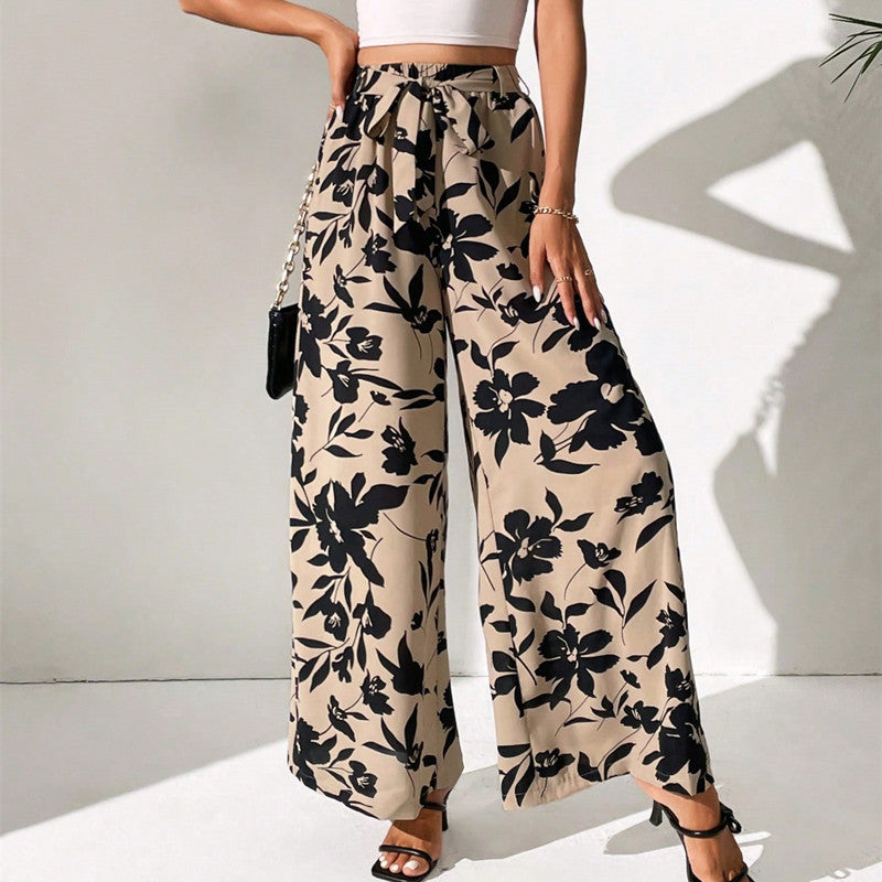 Pantalones de talle alto y pierna ancha con estampado floral de Isabella Sol.