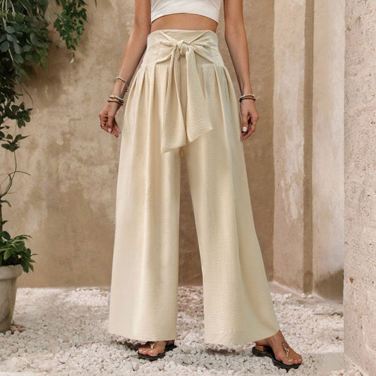 Pantalones casuales de mujer de talle alto, color liso, con lazo frontal y pernera ancha.