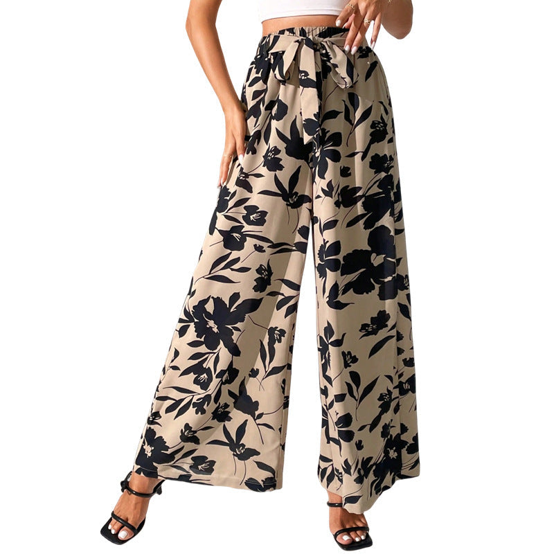 Pantalones de talle alto y pierna ancha con estampado floral de Isabella Sol.