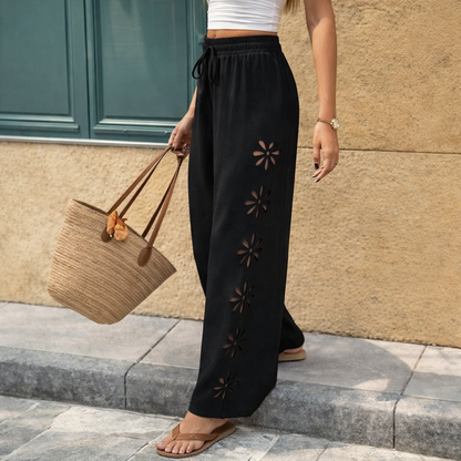 Pantalones elegantes de Isabella Sol con cordón ajustable y aberturas florales.
